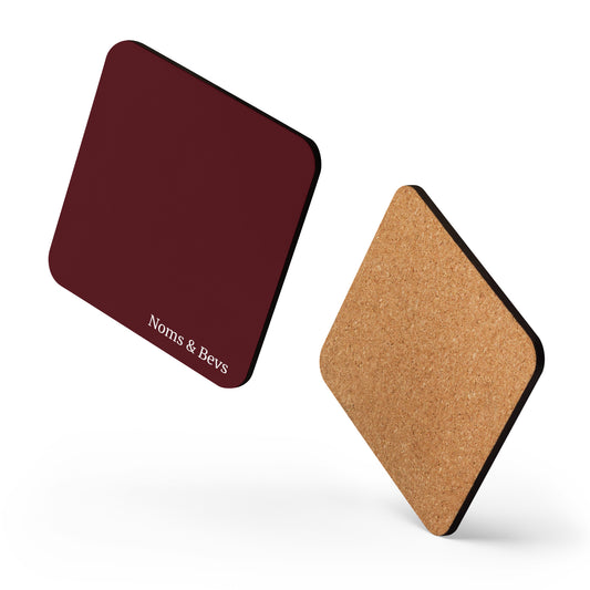 Product mockup of a Pinot Noir Red Coaster with the Noms & Bevs logo and cork backing.